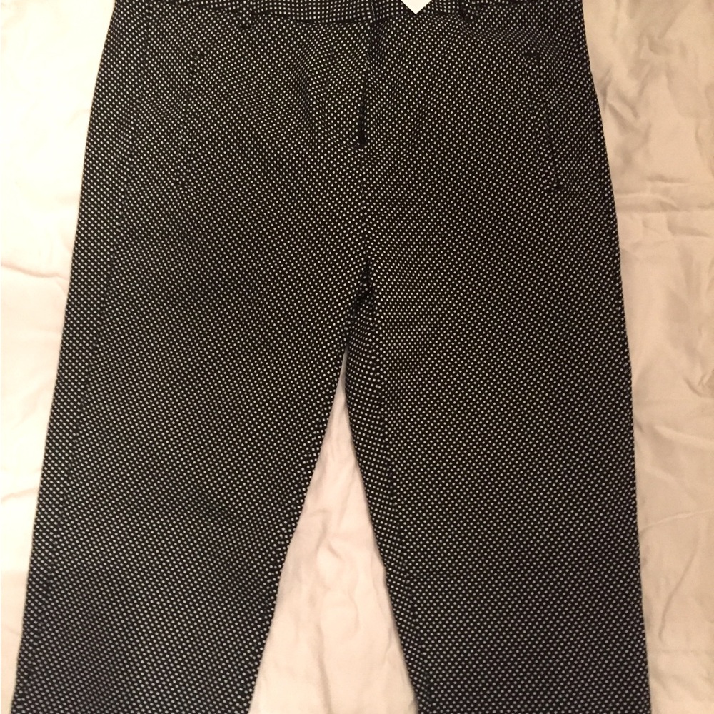 NWT black dotted stretch skinny pants, sz Medium.